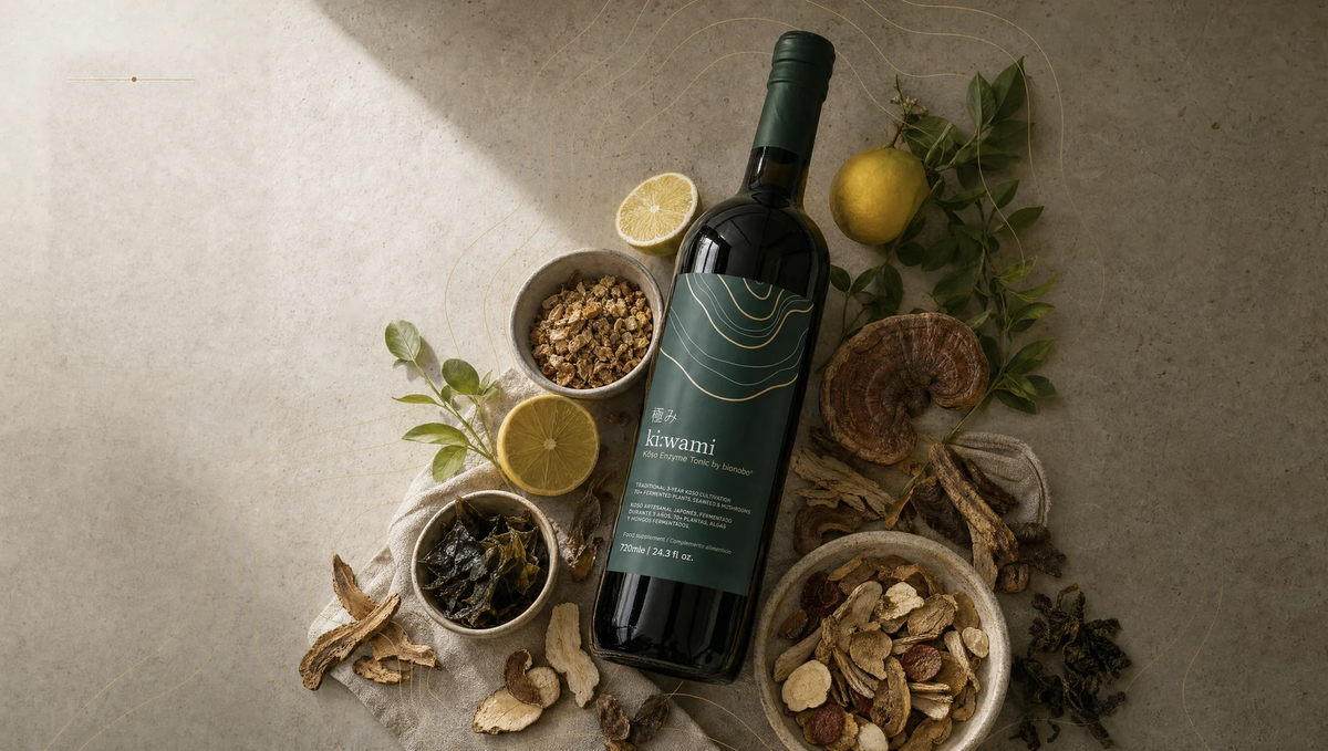 Kiwami fermented-enzyme tonic surrounded by citrus, seaweed, mushrooms, roots and botanical leaves.