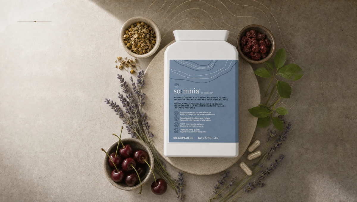 Somnia sleep-support tub surrounded by cherries, lavender, chamomile, leaves and botanical capsules.