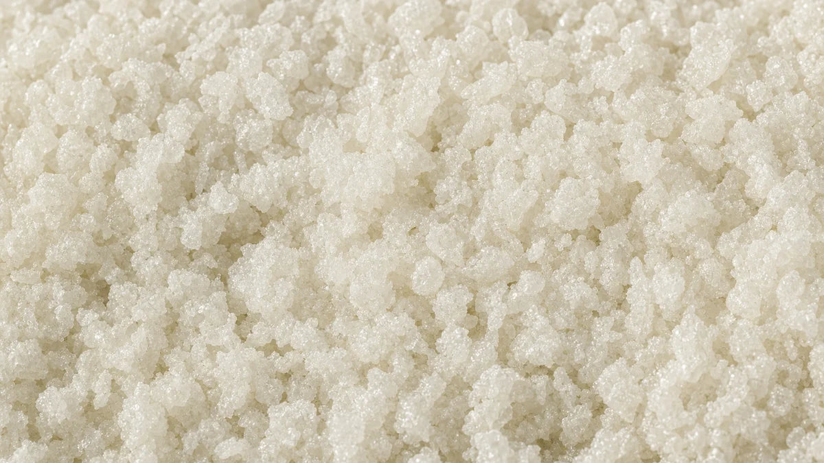 Magnesium bisglycinate, coarse off-white granules with a faint mineral sparkle