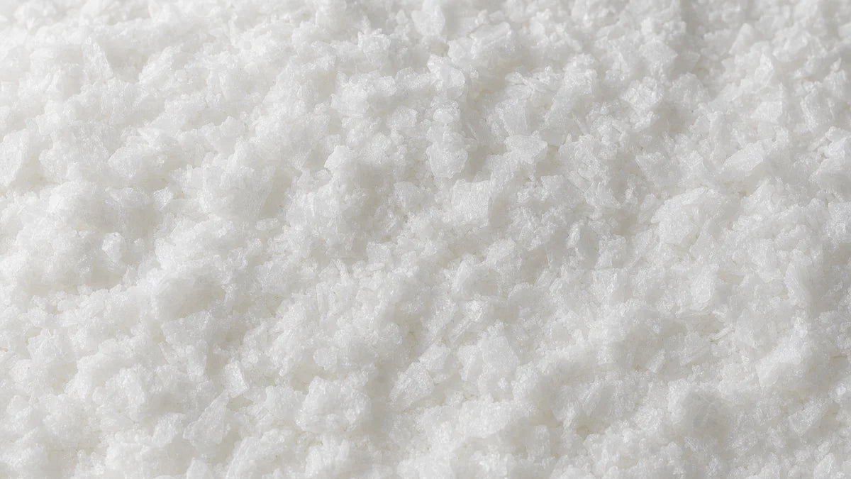 Niacin, a plain white crystalline powder of small flat plates