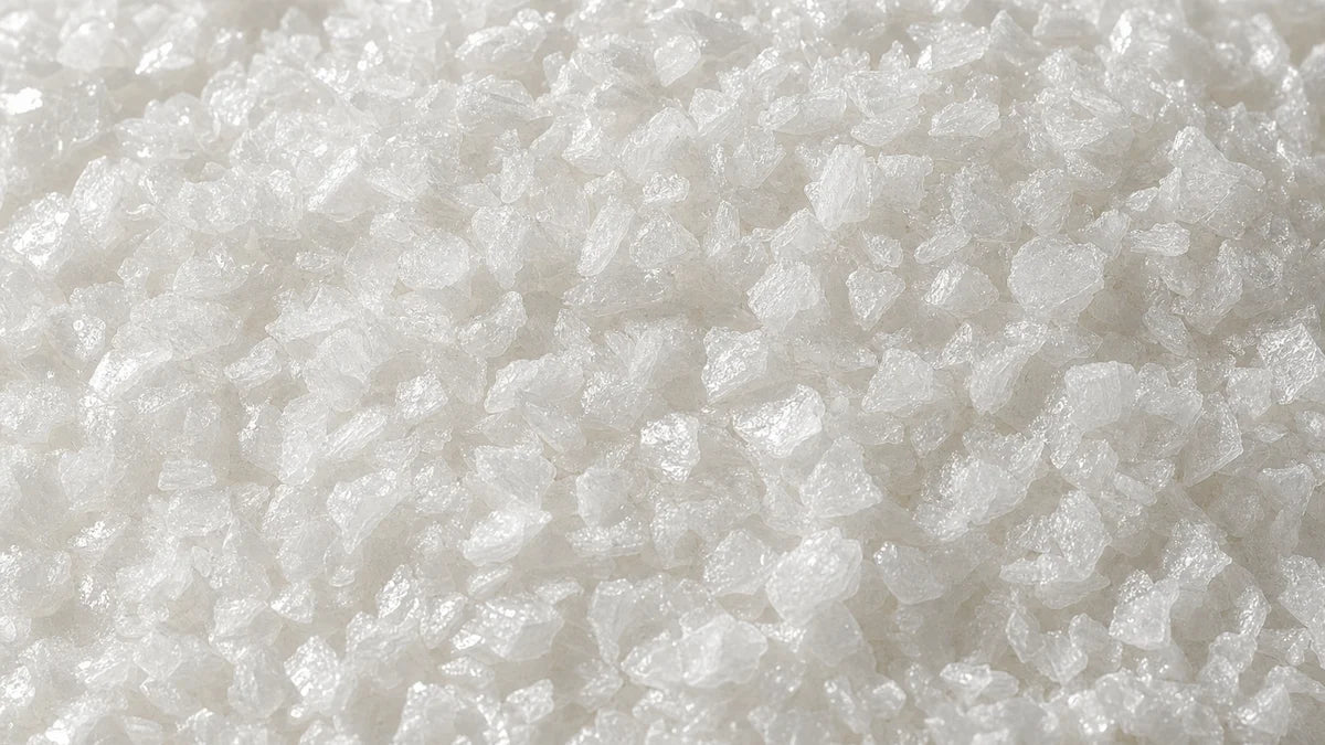 L-taurine, coarse white platy crystals like small flakes of glass