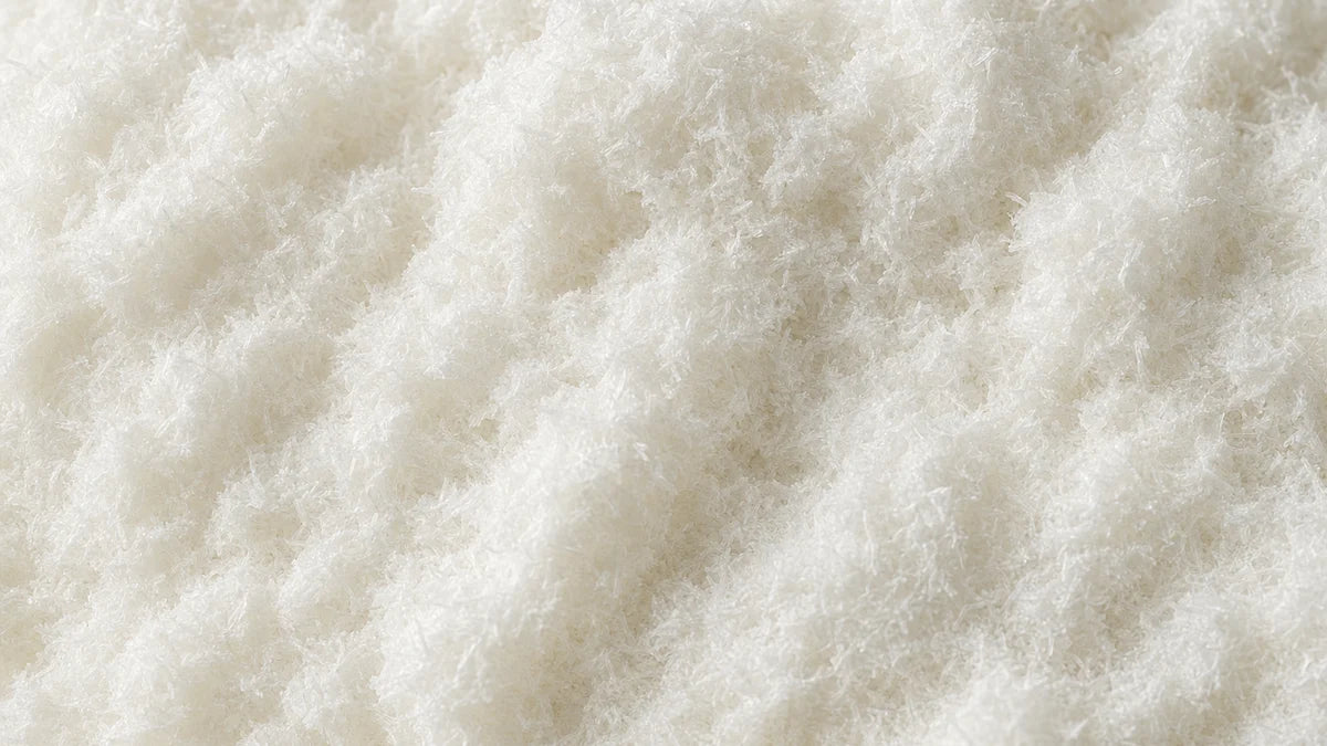 L-tyrosine, a white fibrous crystalline powder of fine short needles